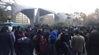 Warga menggelar aksi protes di dekat salah satu universitas di Teheran, ibukota Iran.