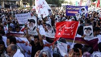 Ali Shamkhani, Sekretaris Dewan Keamanan Nasional Tertinggi Iran menuduh AS, Inggris dan Arab Saudi mendalangi aksi-aksi protes tersebut. Tasnim News Agency/Handout via REUTERS.