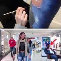 Karya Jen di foto ini sempat menjadi viral. Dia mengirim seorang model cantik berambut pirang pergi mengelilingi mal dan mengunjungi beberapa toko pakaian tanpa mengenakan busana. Dan tak ada yang menyadari kalau si model sebenarnya tanpa busana. Hal itu karena si model memakai lukisan crop top hitam dan celana jeans detail robek karya Jen. Foto: Instagram