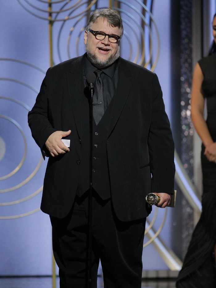 Guillermo del Toro BEVERLY HILLS, CA - JANUARY 07:  In this handout photo provided by NBCUniversal, Guillermo del Toro accepts the award for Best Director β Motion Picture for βThe Shape of Waterβ   during the 75th Annual Golden Globe Awards at The Beverly Hilton Hotel on January 7, 2018 in Beverly Hills, California.  (Photo by Paul Drinkwater/NBCUniversal via Getty Images)