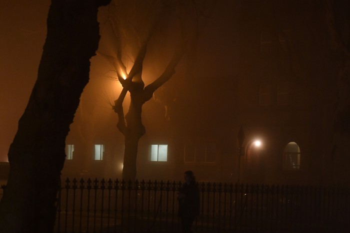 A person cycles through heavy fog in Dublin, Ireland, January 11, 2018. Picture taken January 11, 2018. REUTERS/Clodagh Kilcoyne