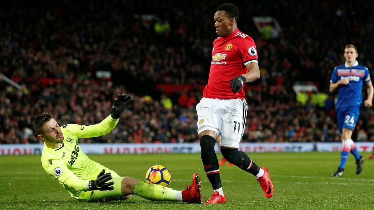 Manchester United menang telak 3-0 atas Stoke City (Andrew Yates/Reuters)