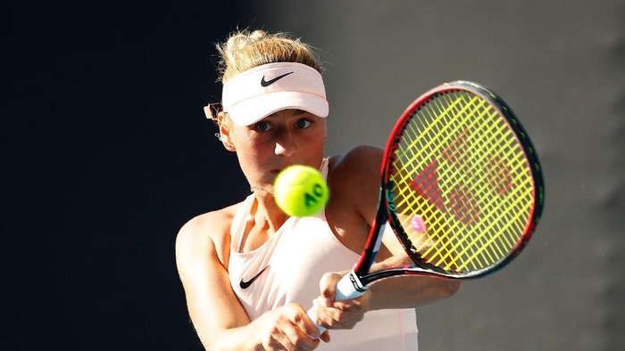 MELBOURNE, AUSTRALIA - JANUARY 15:  Marta Kostyuk of Ukraine plays a backhand in her first round match against Shuai Peng of China on day one of the 2018 Australian Open at Melbourne Park on January 15, 2018 in Melbourne, Australia.  (Photo by Scott Barbour/Getty Images)