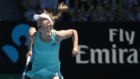 Teriakan kemenangan Elise Mertens. REUTERS/Thomas Peter.