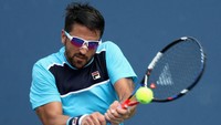 Salah satu petenis putra lain yang memakai kacamata saat bermain adalah Janko Tipsarevic dari Serbia. (Foto: Rob Carr/Getty Images)