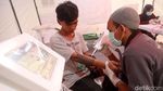 Foto: Ratusan Orang Ikuti Layanan Hapus Tato