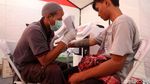 Foto: Ratusan Orang Ikuti Layanan Hapus Tato