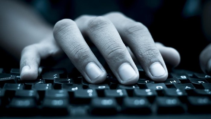 Human hand on keyboard,isolated, selective focus, shallow depth of field, concept of work & technology.