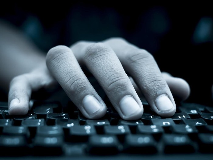 Human hand on keyboard,isolated, selective focus, shallow depth of field, concept of work & technology.