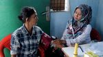 Banjir Surut, Warga Malah Asyik Mancing dan Bersihkan Lumpur