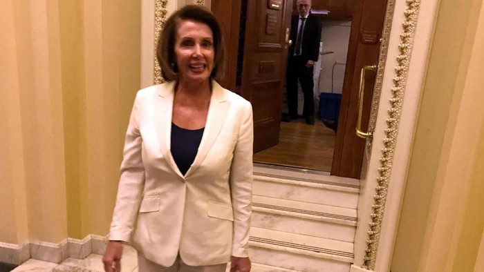 U.S. House Democratic leader Nancy Pelosi emerges from a record-breaking 8-hour speech on the floor of the House of Representatives in support of young illegal immigrants known as ÒDreamersÓ on Capitol Hill in Washington, D.C., U.S. February 7, 2018.  REUTERS/David Morgan