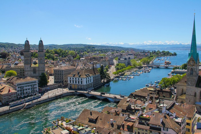 A view of the city centre of Zurich and the surrounding mountains.
