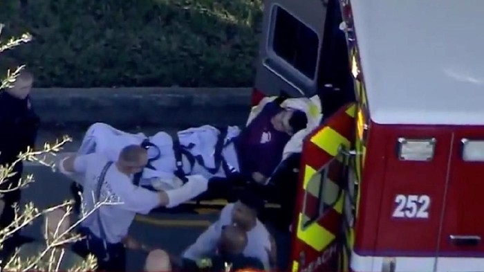 A man who was placed in handcuffs by police is loaded into a paramedic vehicle after a shooting incident at Marjory Stoneman Douglas High School in Parkland, Florida, U.S. February 14, 2018 in a still image from video.  WSVN.com via REUTERS. ATTENTION EDITORS - THIS IMAGES HAS BEEN PROVIDED BY A THIRD PARTY. NO RESALES, NO ARCHIVES. MANDATORY CREDIT. NO ACCESS SOUTHEAST FLORIDA MEDIA.