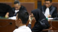 Rita Widyasari dan Khairudin duduk di kursi pesakitan.