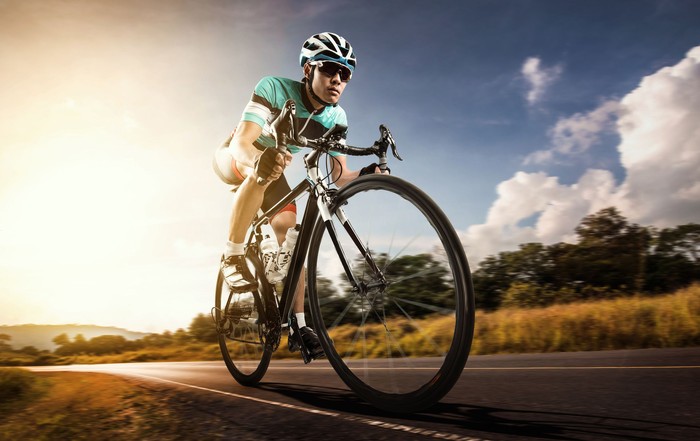 Asian men are cycling road bike in the morning