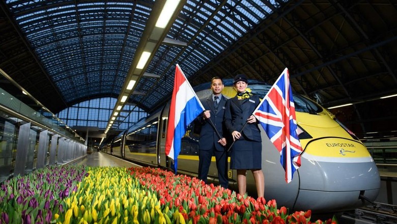 LONDON, ENGLAND - FEBRUARY 20: Eurostar staff members Silvester Entong and Kimberley Schaap are seen as the inaugural Eurostar service sets off from London to Amsterdam as ticket sales open for the new route on February 20, 2018 in London, England. (Photo by Jonathan Hordle/Getty Images for Eurostar)