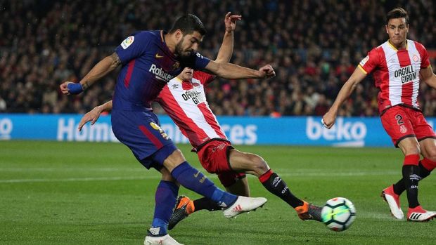 Luis Suarez mencetak gol pertamanya ke gawang Girona pada laga tersebut. (