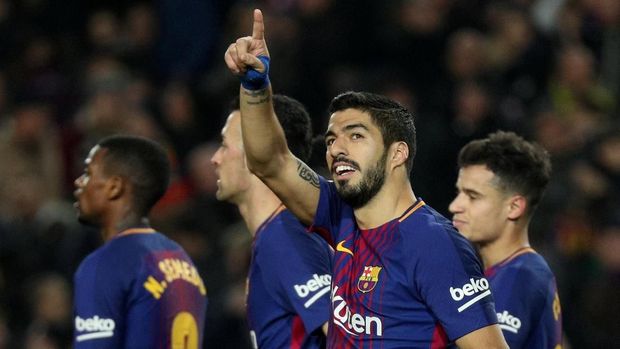 Luis Suarez mencetak hattrick untuk Barcelona ke gawang Girona. (