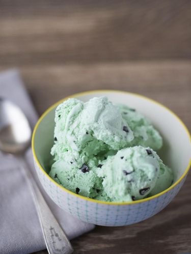 A delicious bowl of mint chocolate chip ice cream.