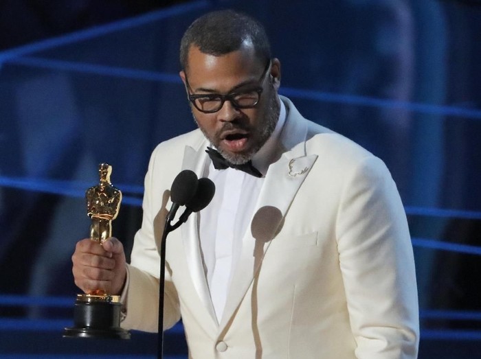 90th Academy Awards - Oscars Show - Hollywood, California, U.S., 04/03/2018 - Jordan Peele accepts the Oscar for Best Original Screenplay for Get Out. REUTERS/Lucas Jackson