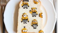 Ukiran Minion yang menggemaskan ini, dibuat dari wijen hitam, whipped cream, jungan selai kentang manis berwarna kuning. Foto: Instagram @Nayoko054