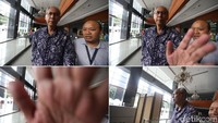 Detik-detik dokter Bimanesh menutupi kamera jurnalis yang memotretnya di Pengadilan Tipikor, Jakarta, Kamis (8/3/2018).