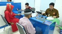 Foto: Kantor Imigrasi Klas I Khusus Jakarta Barat ini  membuka Unit Layanan Paspor (ULP) di Kompleks Ruko Apartamen Gadjah Mada dan di Rukan Permana Kora, Jalan Tubagus Angke.  Fotografer: Muhammad Taufiqqurrahman/detikcom
