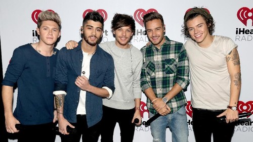 BURBANK, CA - NOVEMBER 22:  (L-R) Musicians Niall Horan, Zayn Malik, Louis Tomlinson, Liam Payne, and Harry Styles of the band One Direction during the One Direction iHeartRadio Album Release Party hosted by Ryan Seacrest at the iHeartRadio Theater Los Angeles ? Clear Channels new music and events venue located at The Burbank Studios in Burbank, CA  (Photo by Christopher Polk/Getty Images for Clear Channel)
