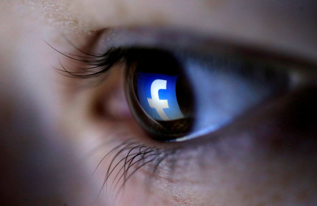 FILE PHOTO: A picture illustration shows a Facebook logo reflected in a person's eye, in Zenica, March 13, 2015.  REUTERS/Dado Ruvic/Illustration/File Photo