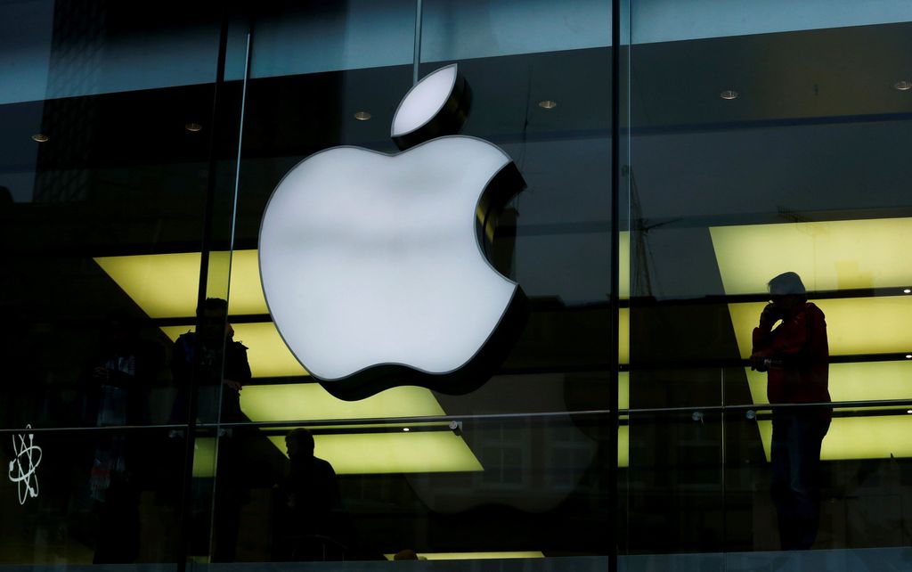 FILE PHOTO: An Apple logo is seen on the building's facade as activists from the anti-globalisation organisation Attac hold the protest against alleged tax evasion by Apple company in front of an Apple store in Frankfurt, Germany, March 10, 2018. REUTERS/Ralph Orlowski/File Photo