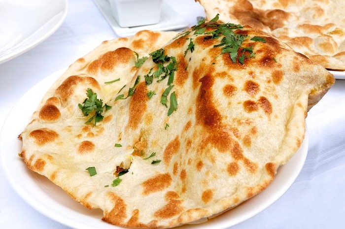 Indian naan bread served on a plate - resubmit with improved lighting