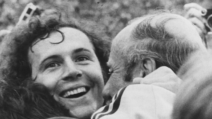 West German footballer Franz Beckenbauer beams with joy as he is embraced by coach Helmut Schon, after his team beat Holland 2-1 to win the 1974 World Cup.   (Photo by Keystone/Getty Images)