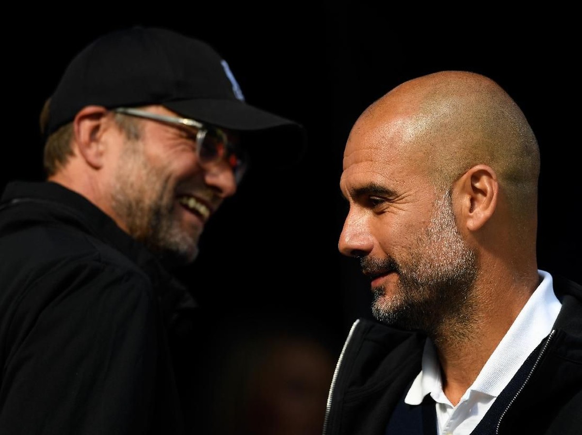 Juergen Klopp dan Jose Guardiola kembali berhadapan saat Liverpool dan Manchester City bertemu di Liga Champions (Stu Forster/Getty Images)