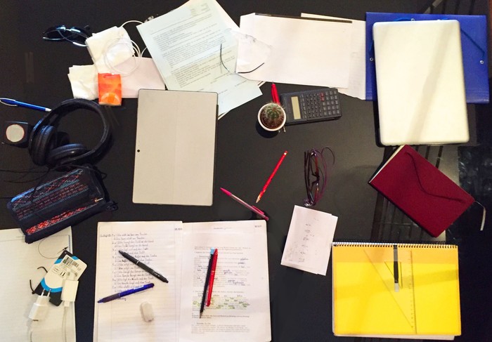 Messy desk top view