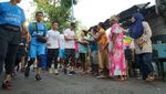Foto: Aksi Sandiaga Lari 5 Kilometer Susuri Ciliwung