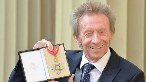 LONDON, UNITED KINGDOM - MARCH 11: Former Scotland and Manchester United footballer Denis Law poses with his  Commander of the Order of the British Empire (CBE) medal that was presented to him by the Duke of Cambridge during an Investiture ceremony at Buckingham Palace on March 11, 2016 in London, United Kingdom. (Photo by John Stillwell - WPA Pool/Getty Images)