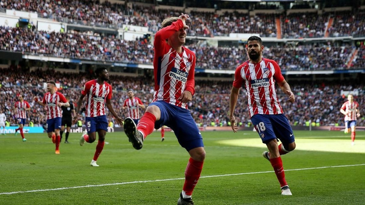Antoine Griezmann melakukan selebrasi usai menjebol gawang Real Madrid (Sergio Perez/Reuters)