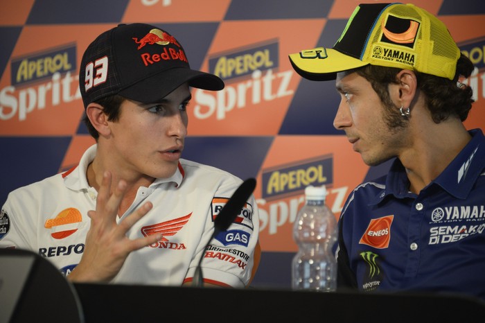 MISANO ADRIATICO, ITALY - SEPTEMBER 12:  Valentino Rossi of Italy and Yamaha Factory Racing speaks with Marc Marquez of Spain and Repsol Honda Team (L) during the press conference during the MotoGP of San Marino - Previews at Misano World Circuit on September 12, 2013 in Misano Adriatico, Italy.  (Photo by Mirco Lazzari gp/Getty Images)