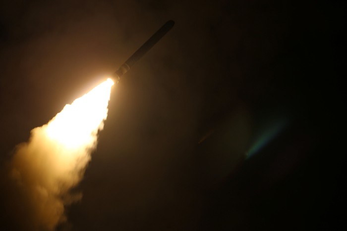 The U.S. Navy guided-missile cruiser USS Monterey is lit as it fires Tomahawk land attack missiles in this still image from Pentagons video released on April 14, 2018.   U.S. Navy Lt. j.g Matthew Daniels/Handout via REUTERS. ATTENTION EDITORS - THIS IMAGE WAS PROVIDED BY A THIRD PARTY
