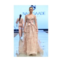 Koleksi couture lainnya yang menarik adalah karya Nada Saade. Desainer busana pernikahan ini menampilkan palet warna yang lembut dengan beberapa twist pada busananya. Foto: Instagram/ArabFashionConcil