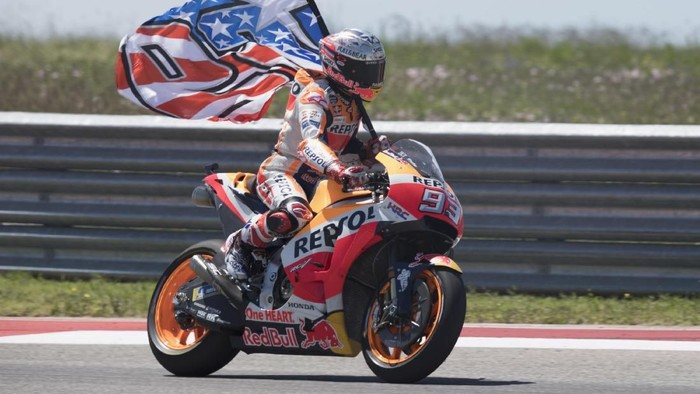 AUSTIN, TX - APRIL 22:  Marc Marquez of Spain and Repsol Honda Team celebrates the MotoGP victory with the flag at the end of the MotoGP race during the MotoGp Red Bull U.S. Grand Prix of The Americas - Race at Circuit of The Americas on April 22, 2018 in Austin, Texas.  (Photo by Getty Images/Getty Images)