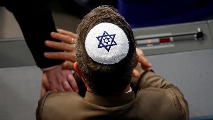 Members of the parliament wearing kippas attend a session of the lower house of parliament Bundestag in Berlin, Germany, April 26, 2018. REUTERS/Axel Schmidt