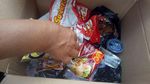 Foto: Ini Kupon dan Isi Paket Sembako yang Dibagikan di Monas