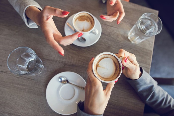 Young Women Drinking Coffee Concept