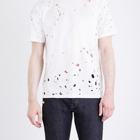 Punya kaus polos di rumah? Coba deh bikin berlubang seperti T-shirt Selfridges ini yang dijual 425 pounds atau Rp 8 juta. Foto: Ist.