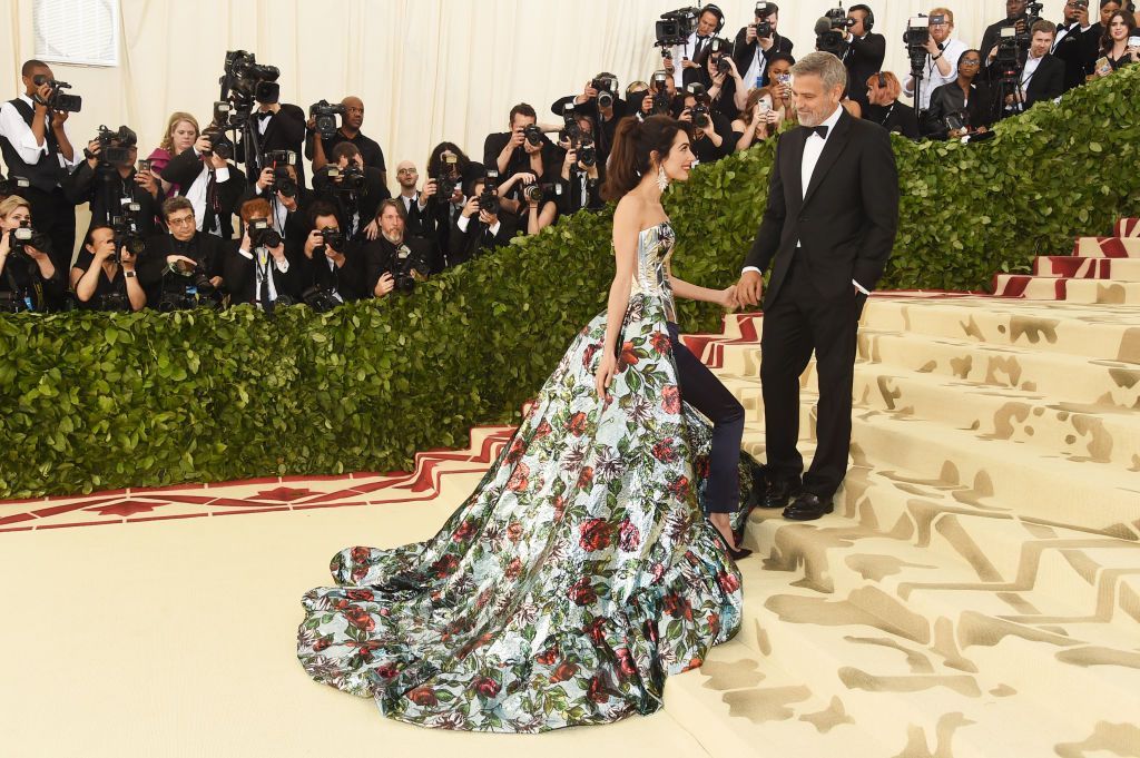 NEW YORK, NY - MAY 07:  Amal Clooney and George Clooney attend the Heavenly Bodies: Fashion & The Catholic Imagination Costume Institute Gala at The Metropolitan Museum of Art on May 7, 2018 in New York City.  (Photo by Jamie McCarthy/Getty Images)