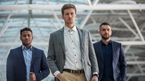 Best team. Portrait of stylish qualified young businessmen are standing together and looking at camera seriously while expressing confidence. Selective focus