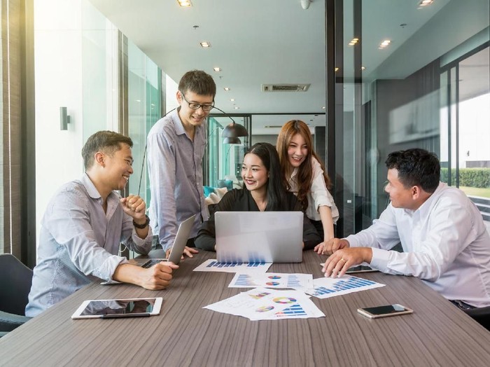 Group Of AsianBusiness people with casual suit working and brainstorming with happy action and celebrate in the modern Office, people business group concept