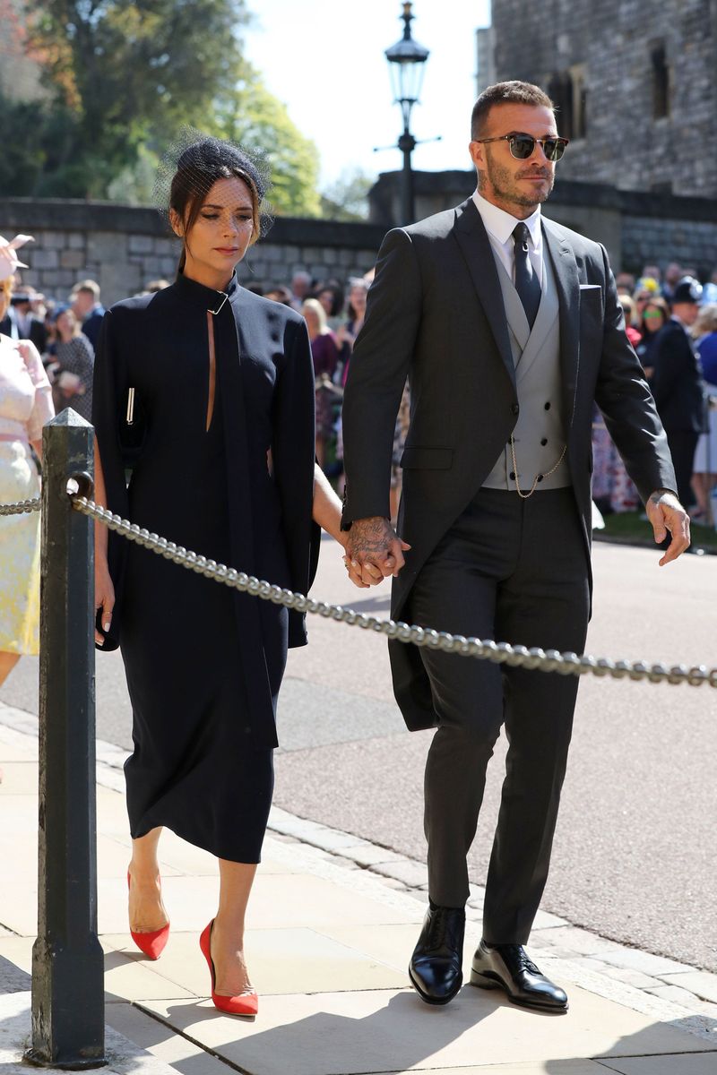 WINDSOR, UNITED KINGDOM - MAY 19:  David Beckham and Victoria Beckham arrive at St George's Chapel at Windsor Castle before the wedding of Prince Harry to Meghan Markle on May 19, 2018 in Windsor, England. (Photo by Gareth Fuller - WPA Pool/Getty Images)