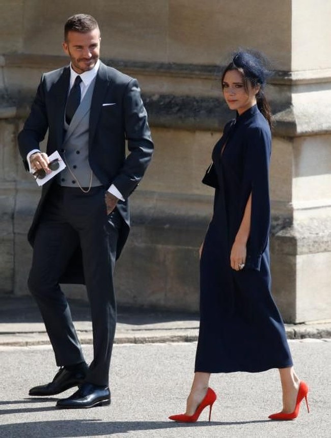 David dan Victoria Beckham tiba di gereja St. Georges Chapel yang berada di komplek Kastil Windsor, Windsor, Inggris, Sabtu (19/5/2018), untuk menghadiri pernikahan Pangeran Harry dan Meghan Markle. Foto: Getty Images
